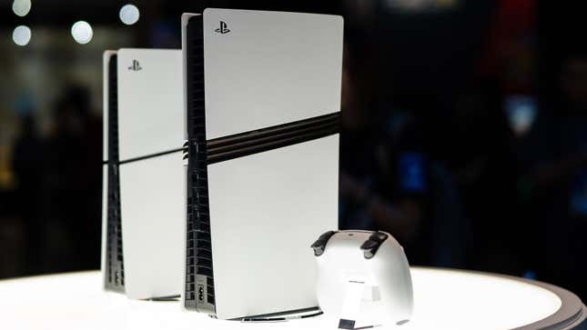 PlayStation 5 consoles sit in a display case.