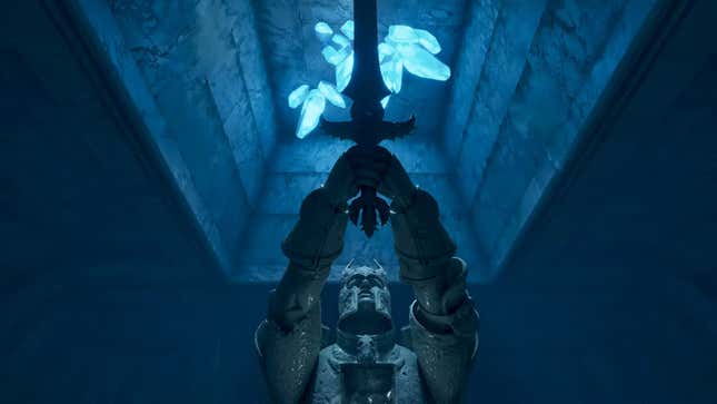 A statue holds up a sword in an underground scene.