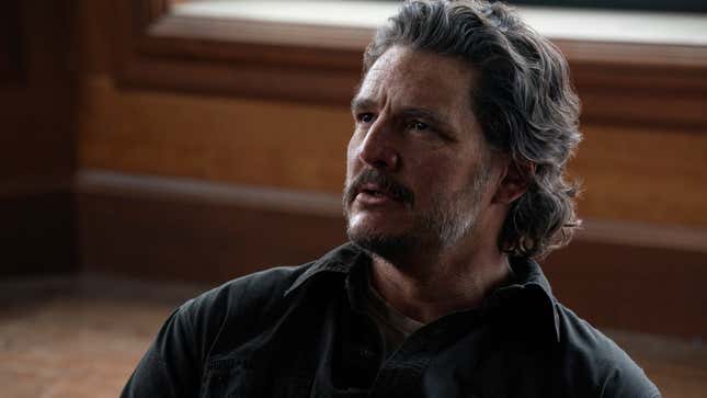 Joel looks at something off-screen.