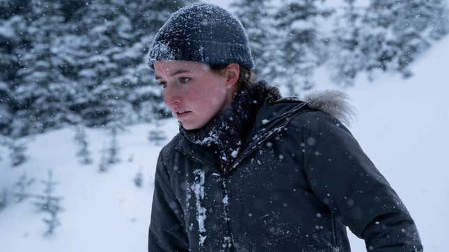 Abby looks at something off-screen.
